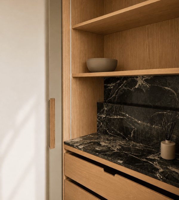 Kitchen details cycling through brass, stone, and oak elements
